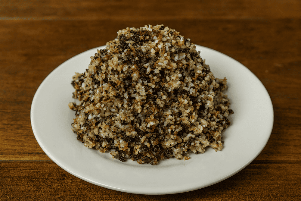 Ant Egg Sticky Rice is a unique sticky rice dish topped with ant eggs, delivering a creamy, nutty flavor and protein-packed bite